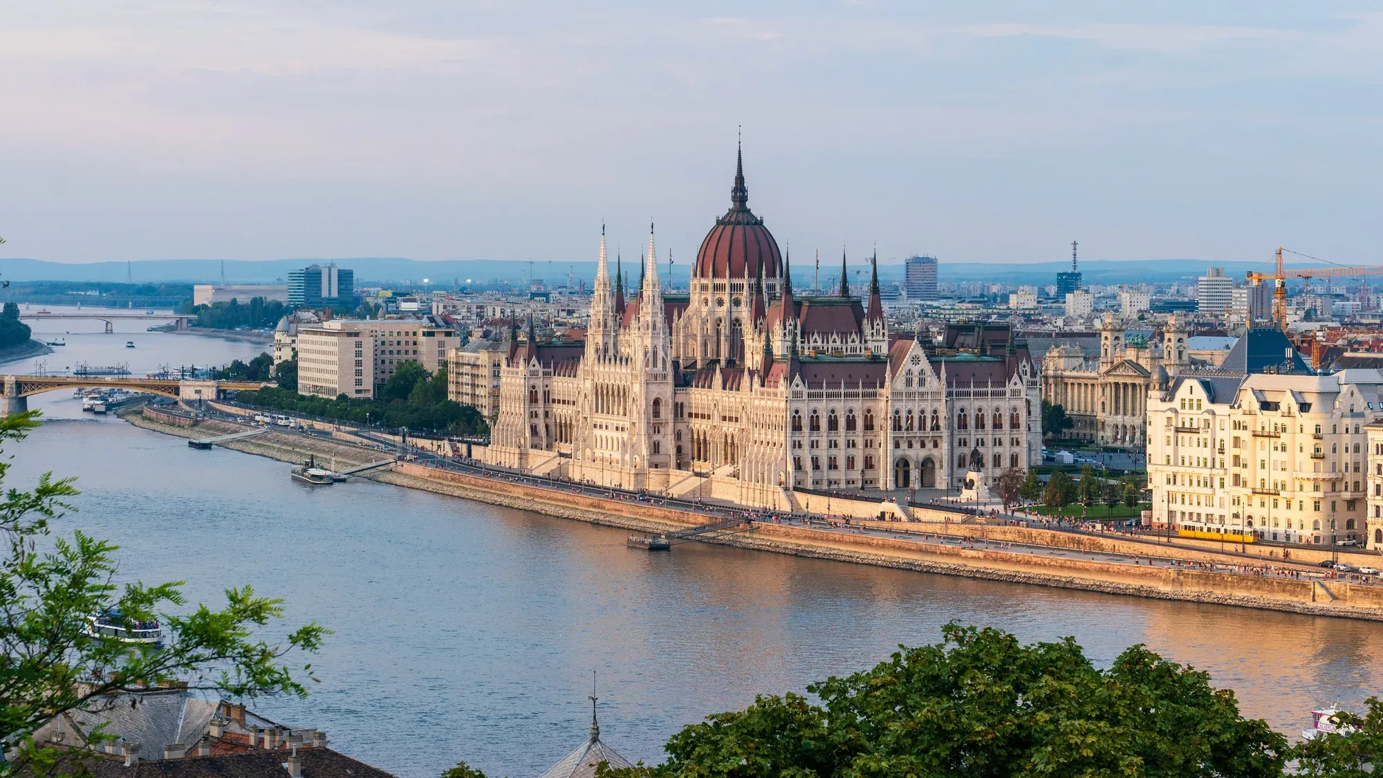 The Hungarian Parliament along the Danube in Budapest, seen from the Buda hillside in evening light
